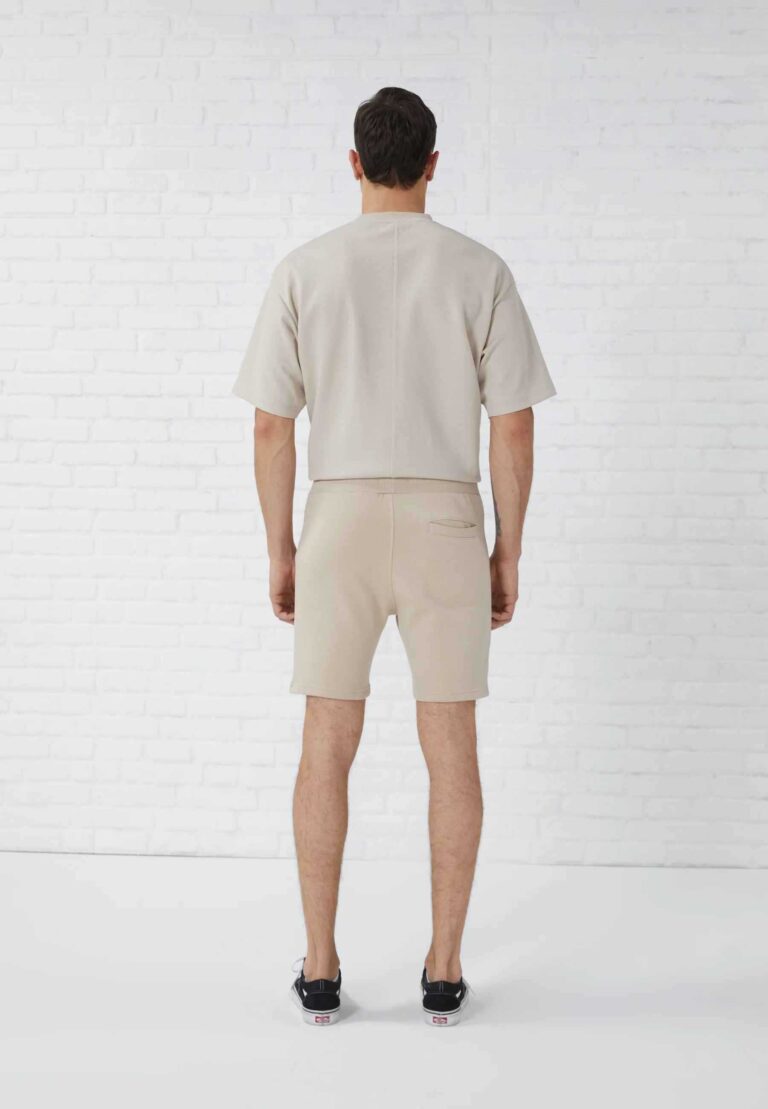 Vintage washed men's oversized t-shirt and shorts set. Textured fabric, relaxed fit, subtle seam detailing. Perfect casual st