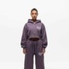 Knit women's tracksuit set. Fleece joggers, custom logo on sweatshirt. Soft, textured knit, quality stitching. Comfortable an