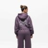 Knit women's tracksuit set. Fleece joggers, custom logo on sweatshirt. Soft, textured knit, quality stitching. Comfortable an