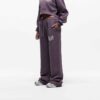 Knit women's tracksuit set. Fleece joggers, custom logo on sweatshirt. Soft, textured knit, quality stitching. Comfortable an