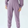 Women's hooded sweat set: soft-touch fleece, custom zipper detail, comfortable fit. Visible stitching details. Athleisure sty