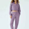 Women's hooded sweat set: soft-touch fleece, custom zipper detail, comfortable fit. Visible stitching details. Athleisure sty