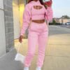 Women's tracksuit. Soft, brushed fleece. Screen printed logo detail. Custom color option. Ribbed cuffs & hem. Sporty, comfort