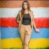 Women's zip-front tracksuit set. Soft-looking knit fabric, custom pocket detailing. Casual athletic style, likely for wholesa