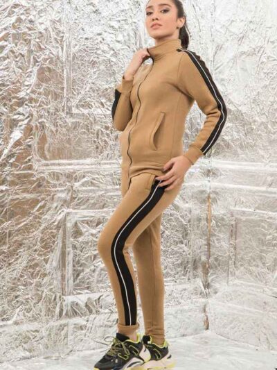 Women's zip-front tracksuit set. Soft-looking knit fabric, custom pocket detailing. Casual athletic style, likely for wholesa