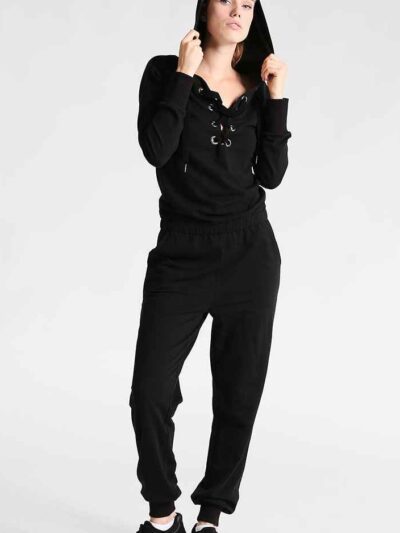 Women's lace-up tracksuit. Close-up shows soft, textured fabric. Dark grey with subtle stitch detailing. Sporty two-piece set