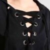 Women's lace-up tracksuit. Close-up shows soft, textured fabric. Dark grey with subtle stitch detailing. Sporty two-piece set