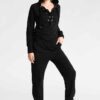 Women's lace-up tracksuit. Close-up shows soft, textured fabric. Dark grey with subtle stitch detailing. Sporty two-piece set