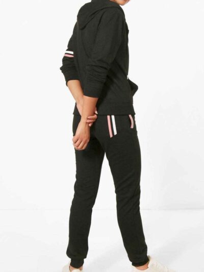 Women's sporty two-piece tracksuit. Stretchy, form-fitting polyester-spandex blend. Visible fine stitching details. Teal and