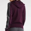 Slim-fit women's tracksuit in soft cotton. Close-up shows fine stitching & comfortable ribbed cuffs. Athletic style, perfect