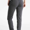 Slim-fit women's tracksuit in soft cotton. Close-up shows fine stitching & comfortable ribbed cuffs. Athletic style, perfect