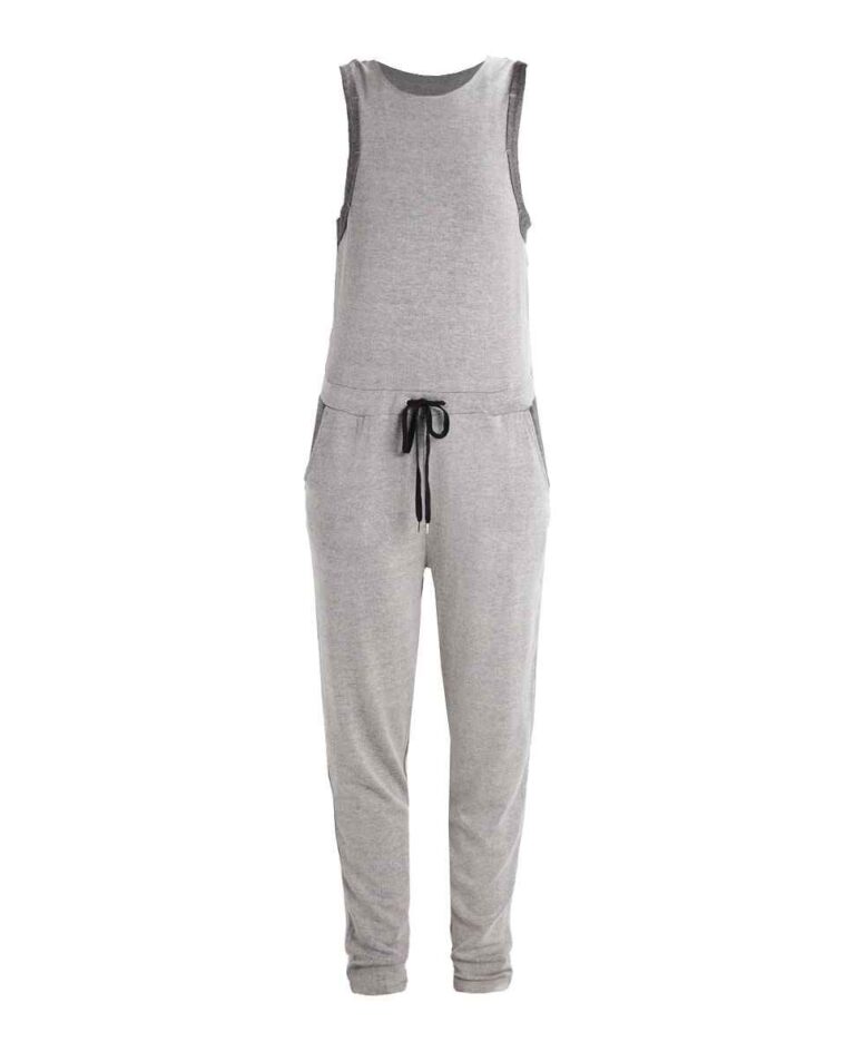 Women's ribbed knit tracksuit set. Close-up shows fine vertical ribbing texture. Soft heathered rose color. Comfortable, styl