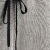 Women's ribbed knit tracksuit set. Close-up shows fine vertical ribbing texture. Soft heathered rose color. Comfortable, styl