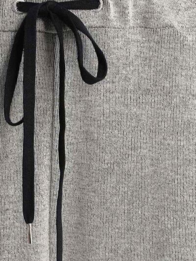 Women's ribbed knit tracksuit set. Close-up shows fine vertical ribbing texture. Soft heathered rose color. Comfortable, styl