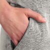 Women's ribbed knit tracksuit set. Close-up shows fine vertical ribbing texture. Soft heathered rose color. Comfortable, styl
