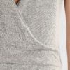 Women's ribbed knit tracksuit set. Close-up shows fine vertical ribbing texture. Soft heathered rose color. Comfortable, styl