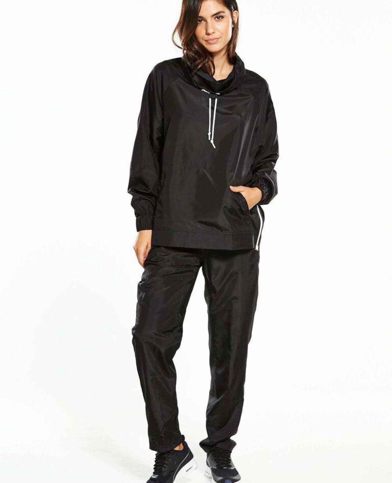 Black woven women's windbreaker tracksuit. Lightweight, subtle sheen, durable stitching. A modern athletic set perfect for la