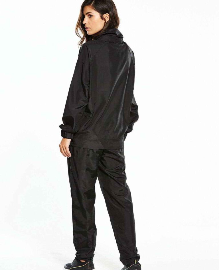 Black woven women's windbreaker tracksuit. Lightweight, subtle sheen, durable stitching. A modern athletic set perfect for la