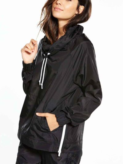 Black woven women's windbreaker tracksuit. Lightweight, subtle sheen, durable stitching. A modern athletic set perfect for la