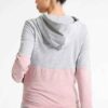 Women's workout set: Sleek jogging suit in heathered grey. Ribbed cuffs, subtle contouring seams. Soft, flexible athletic fab