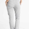 Women's workout set: Sleek jogging suit in heathered grey. Ribbed cuffs, subtle contouring seams. Soft, flexible athletic fab