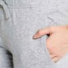 Women's workout set: Sleek jogging suit in heathered grey. Ribbed cuffs, subtle contouring seams. Soft, flexible athletic fab