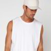 Close-up of a customizable twill cap. Visible stitching details, slightly distressed look, neutral tone. Garment is soft and