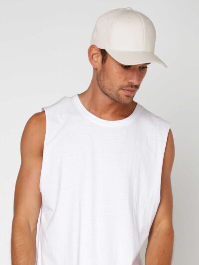 Close-up of a customizable twill cap. Visible stitching details, slightly distressed look, neutral tone. Garment is soft and