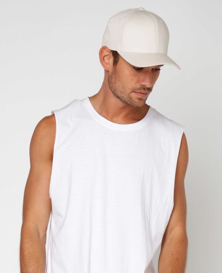 Close-up of a customizable twill cap. Visible stitching details, slightly distressed look, neutral tone. Garment is soft and