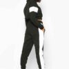 Cropped tracksuit with vibrant color blocking. Notice the textured fabric and neat stitching on this athletic-style top and b