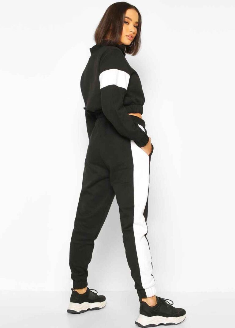 Cropped tracksuit with vibrant color blocking. Notice the textured fabric and neat stitching on this athletic-style top and b
