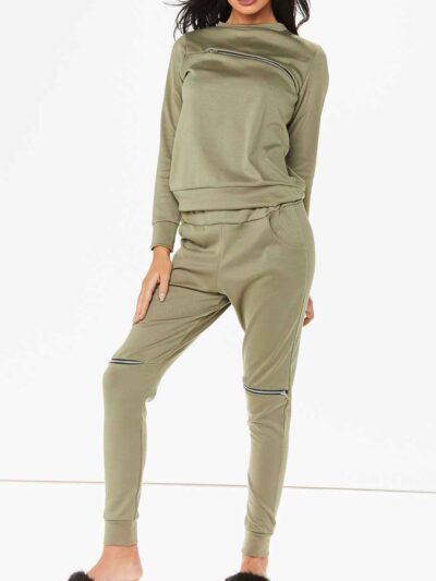 Crewneck sweatsuit with bust zipper. Soft, plush fabric, visible stitching. Custom lounge set, likely pastel or neutral tone.