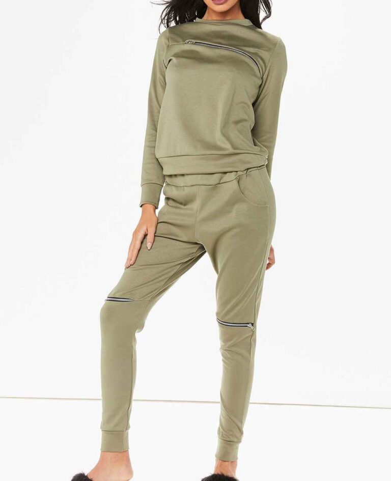 Crewneck sweatsuit with bust zipper. Soft, plush fabric, visible stitching. Custom lounge set, likely pastel or neutral tone.