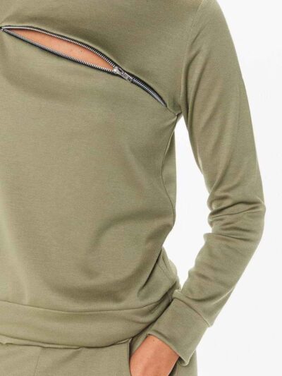 Crewneck sweatsuit with bust zipper. Soft, plush fabric, visible stitching. Custom lounge set, likely pastel or neutral tone.
