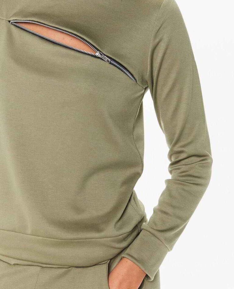 Crewneck sweatsuit with bust zipper. Soft, plush fabric, visible stitching. Custom lounge set, likely pastel or neutral tone.
