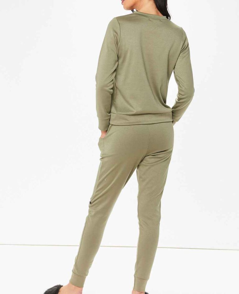 Crewneck sweatsuit with bust zipper. Soft, plush fabric, visible stitching. Custom lounge set, likely pastel or neutral tone.