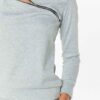 Crewneck sweatsuit with bust zipper. Soft, plush fabric, visible stitching. Custom lounge set, likely pastel or neutral tone.