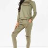Crewneck sweatsuit with bust zipper. Soft, plush fabric, visible stitching. Custom lounge set, likely pastel or neutral tone.
