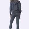 Plus size tracksuit set. Soft, fleece texture apparent, with clean stitching details. Comfortable women's apparel wholesale.