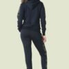Plus size tracksuit set. Soft, fleece texture apparent, with clean stitching details. Comfortable women's apparel wholesale.