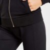Women's zipper tracksuit. Soft-look knit fabric, tailored fit, clean stitching. Hints of grey and pink. Jacket and joggers se